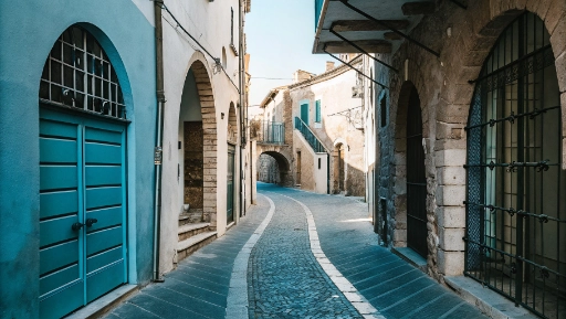 Narrow medieval streets of Terracina historic center with stone buildings and arched doorways